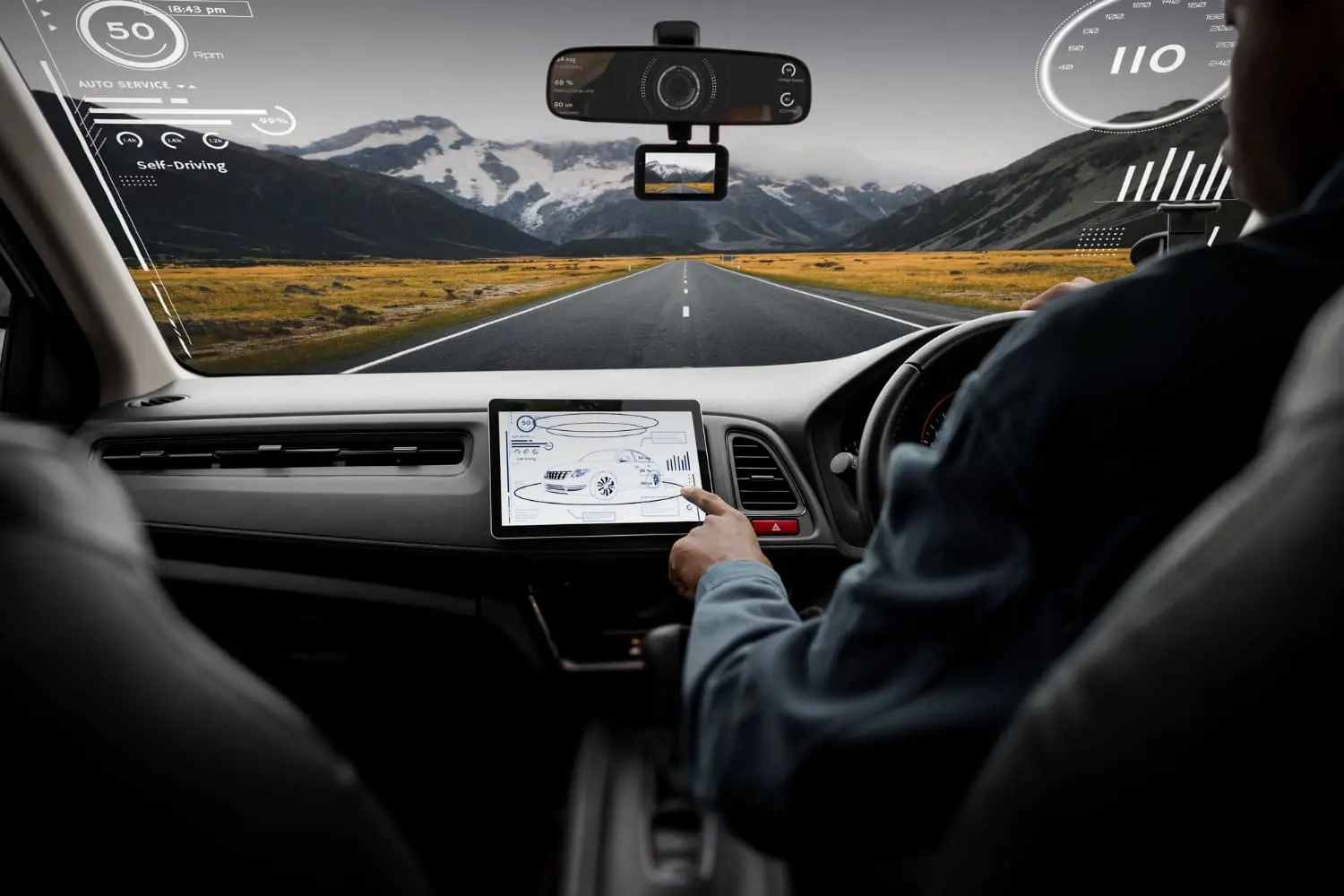 Driver using car touchscreen highlighting how infotainment tech is going too far