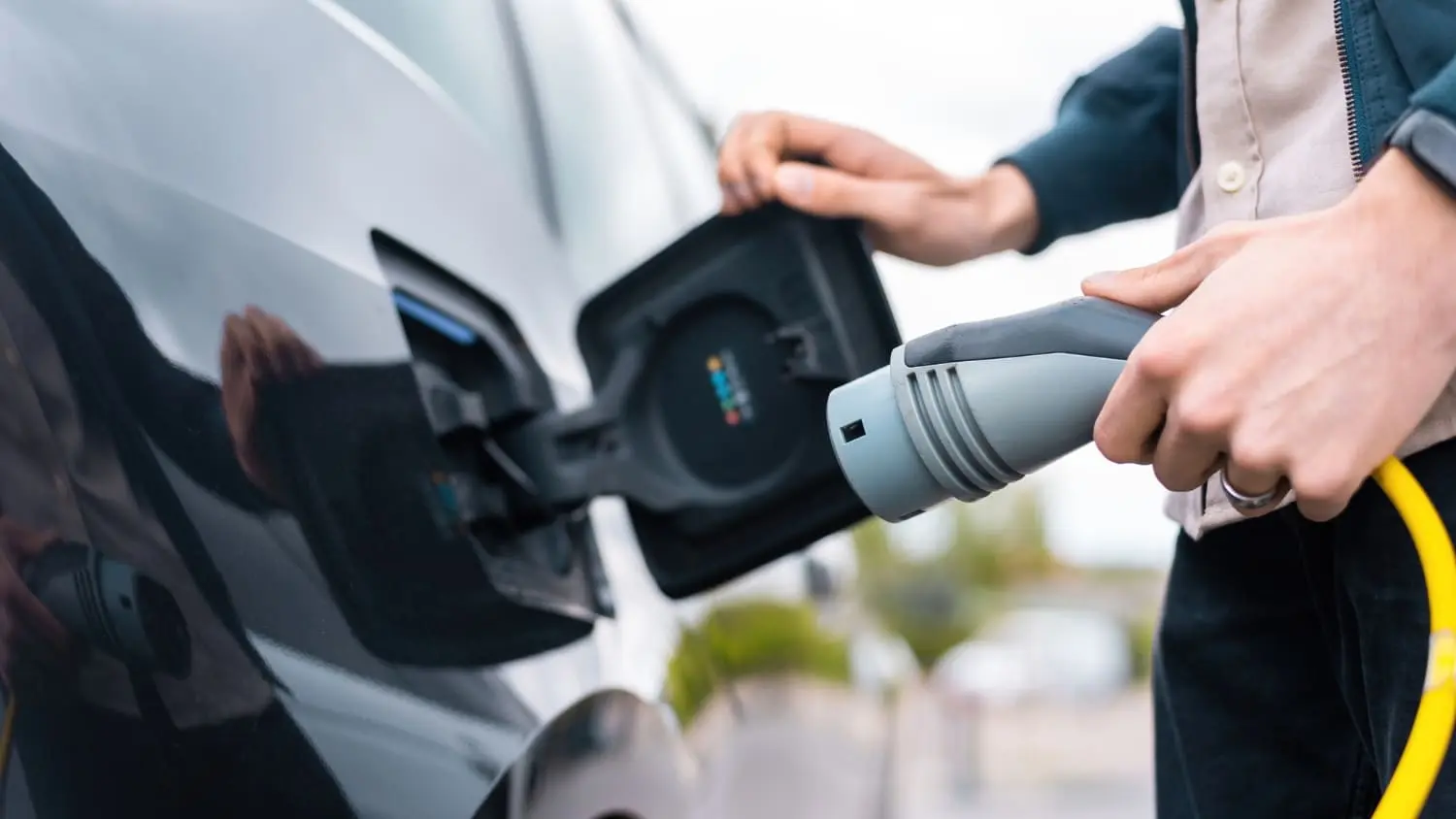 Electric vehicle charging setup illustrating how V2G technology can power a home