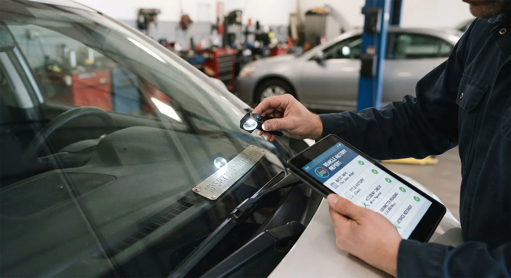Verifying a car's VIN plate against its vehicle history before making a purchase