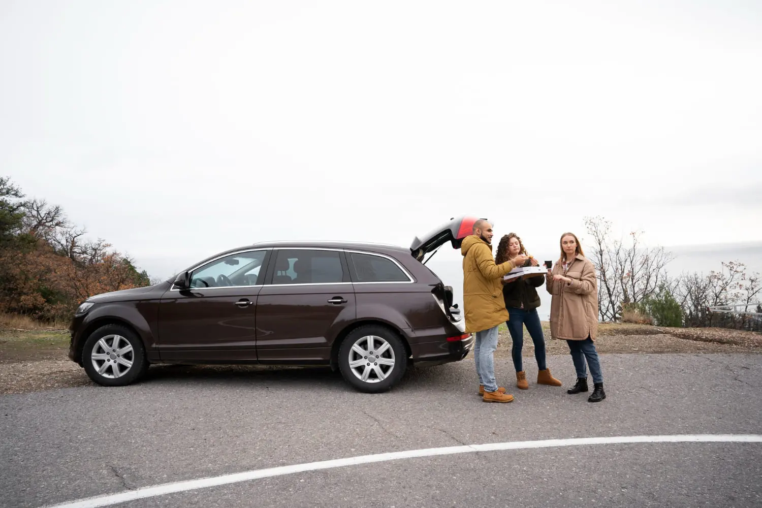 Family on a road trip with a 3-row crossover SUV, a popular rival to the minivan